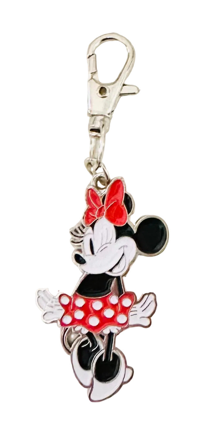 Minnie Mouse keychain with a red bow on a white background