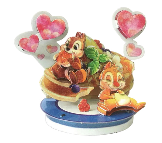Decorative figurine with cartoon characters on a white background