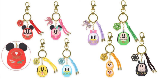 Collection of colorful keychains with various designs on a white background