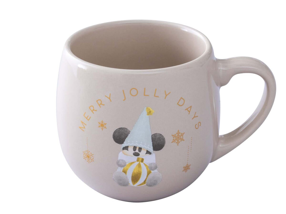 White mug with a festive design featuring a character in a Santa hat and text 'Merry Jolly Days' on a white background.
